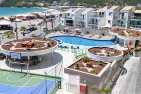 Condomínio Club a 50m PRAIA dos Anjos - Unidades com 2 QUARTOS, PISCINA, estacionamento e portaria 24h - Área de lazer 3000m, wi-fi 600MB, churrasqueira e cozinha completa
